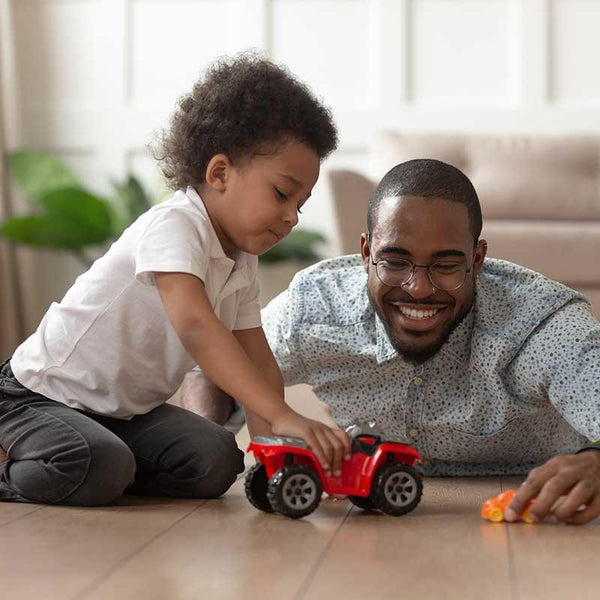 Child playing with toy car on sale